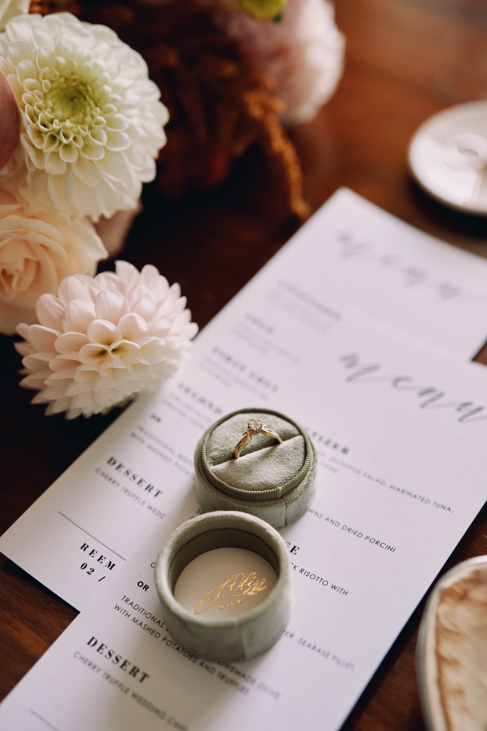 wedding itinerary sample beneath ring boxes